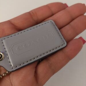 Gray Coach Patent Leather Handbag Hangtag